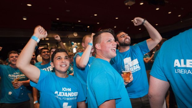 Jubilant Liberal supporters wait for Prime Minister Malcolm Turnbull to speak.