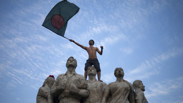 Historic win: A Bangladesh fan celebrates the victory in Dhaka.