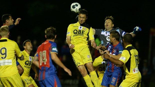 Heads up: Perth Glory player Dino Djulbic rises highest during his side's win over the Newcastle Jets. 