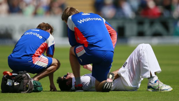Ice pack please ... Alastair Cook receives medical attention after being hit by the ball in the groin.
