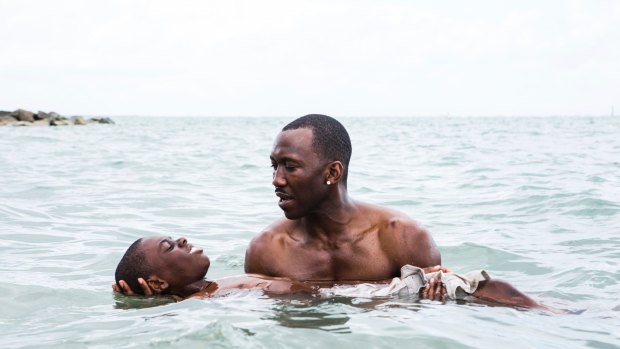 Alex Hibbert, foreground, and Mahershala Ali in Moonlight.