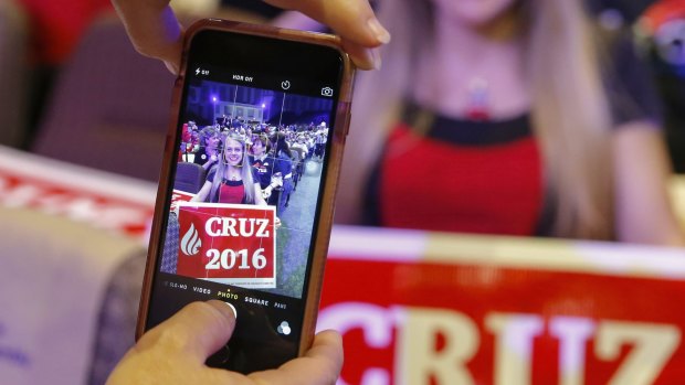 A Cruz supporter poses for a photo in Orlando on Friday.