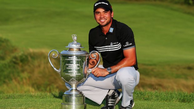 Riding high: Jason Day poses with the Wanamaker trophy.