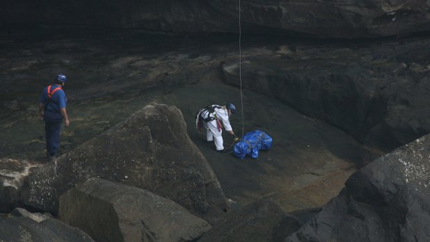 Police with a dummy that was lowered into place at the bottom of The Gap in 2008 during Gordon Wood's trial.