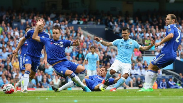 Sergio Aguero scores the opening goal for Manchester City against Chelsea at Etihad Stadium on Sunday.