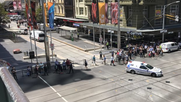 The bomb squad arrives at Bourke Street Mall to investigate a suspicious package.