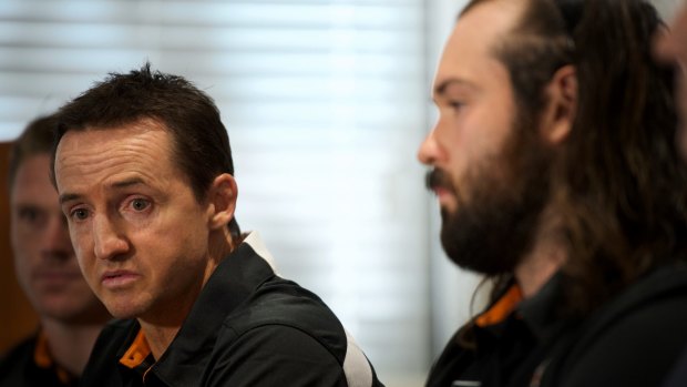 Big decisions: Wests Tigers coach Jason Taylor with captain Aaron Woods.