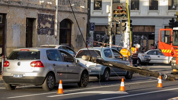 Cars are stuck under power lines near the corner of Brunswick and Johnston streets in Fitzroy. 
