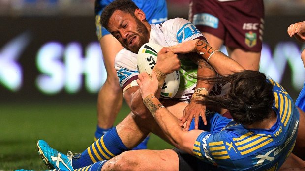 New lease of life: Apisai Koroisau drives over the line to score for Manly.