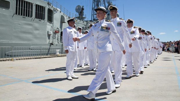 Second in command, Lt Commander Tina Brown, leads the ship's company of the HMAS Darwin, moments before setting sail for the Middle East.