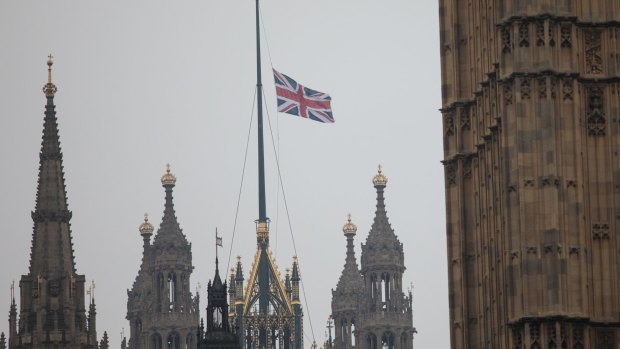 The Union flag flies at half mast above the Houses of Parliament on Friday.