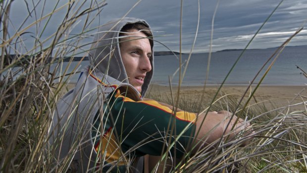 Island life: Ryan Lees on the beach at his home on Flinders Island.