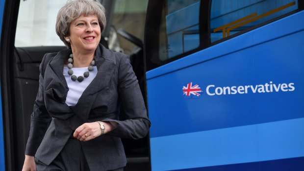 British Prime Minister Theresa May steps off the bus to visit the Cheltenham Science Festival on June 6.