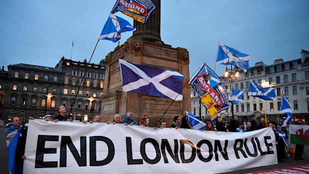 Independence supporters gather in George Square after the announcement that Scotland's First Minister Nicola Sturgeon will ask for permission to hold a second independence referendum. 