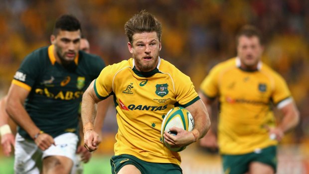 Excited: Rob Horne of the Wallabies runs the ball against the Springboks in Brisbane. 