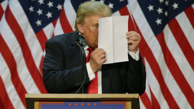 "There's nothing to learn from them," Donald Trump said of his tax returns. Here, he stares at a sheet of talking points and notes as he mocks critics who say he uses prepared speeches or teleprompters, during a rally on May 6, 2016. 