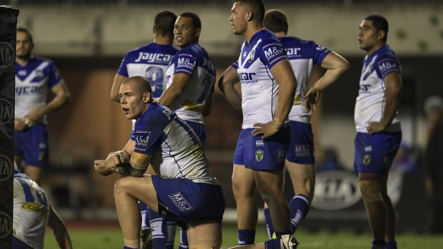 Still chasing fourth spot: Bulldogs players show their dejection during the round-25 match between Canterbury and the North Queensland Cowboys at Belmore.