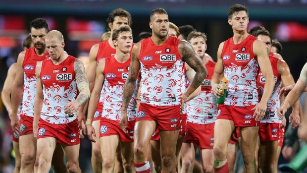 Wings clipped: Lance Franklin and the Swans come to terms with defeat on Friday night.