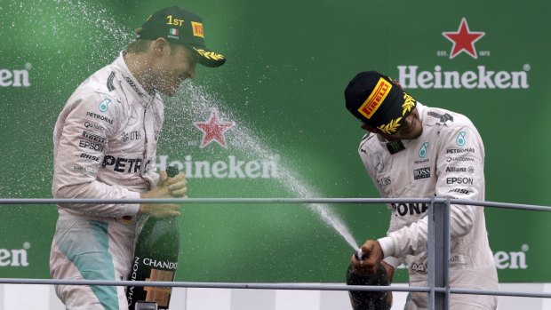 Tense battle: Mercedes teammates Rosberg and Lewis Hamilton, right, are battling for the Driver's Championship.