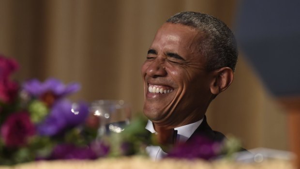 US President Barack Obama laughs as he listens to Larry Wilmore, the guest host from Comedy Central,   at the annual White House Correspondents' Association dinner.