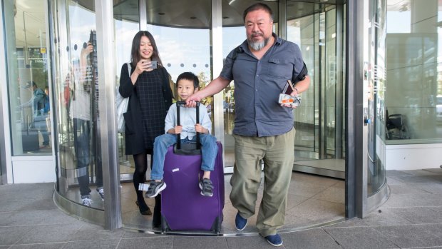 Chinese artist Ai Weiwei leaves Munich Airport with is his wife Lu Qing and his son Ai Lao, aged 6, on Thursday. 