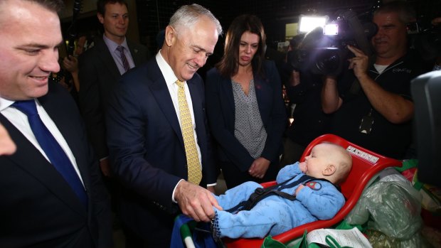 Prime Minister Malcolm Turnbull met four-month-old Ezekiel during a street walk in Stirling in the Adelaide Hills on Friday.