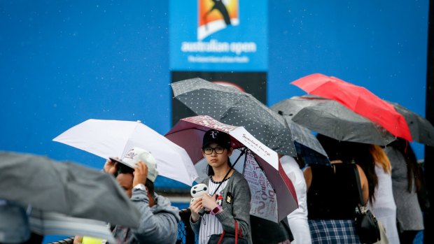 Cool and wet: Day Three at the Australian Open got off to a grey start.