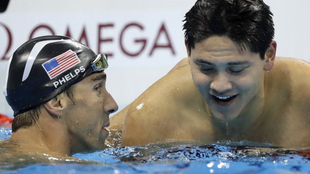 Michael Phelps and Joseph Schooling after the 100-metre butterfly final.