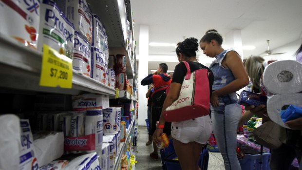 Venezuelans shop for groceries at a supermarket in Cucuta, Colombia, on Sunday.