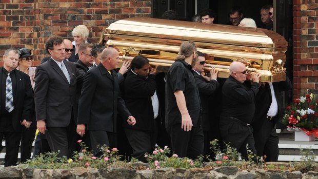 Carl Williams' gold-plated coffin is carried from St Therese's church in Essendon in April 2010. 