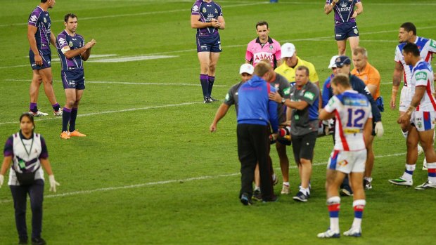 Alex McKinnon is carried off on a stretcher after his injury last year.