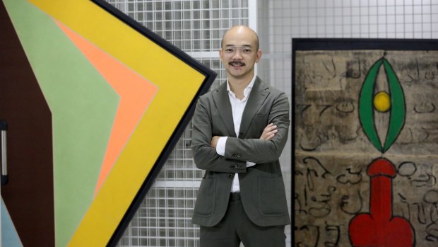 Aaron Seeto at Museum MACAN with Arahmaiani Feisal's 1994 painting Lingga-Yoni (right).