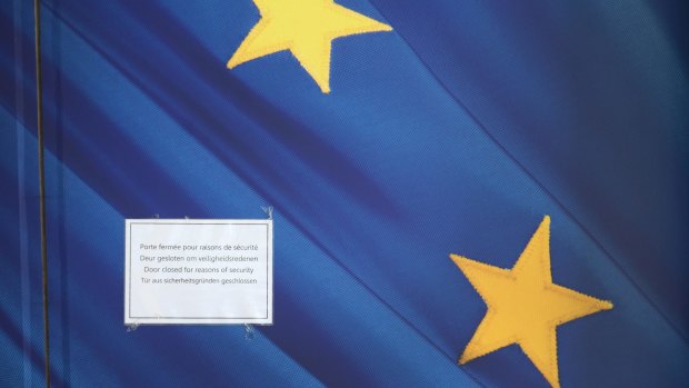 A sign on a door of the EU Commission Headquarters in Brussels reads "Door closed for reasons of security".