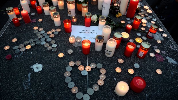 Students and well wishers remember their friends at Joseph-Koenig Gymnasium secondary school in Haltern am See, Germany.