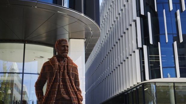 A statue of Andrew Inglis Clark, a lawyer who co-authored Australia's constitution, sits outside Constitution Place.