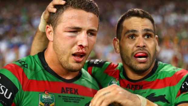 Heading back?: Sam Burgess, pictured with Greg Inglis after winning the 2014 NRL Grand Final with the South Sydney Rabbitohs.