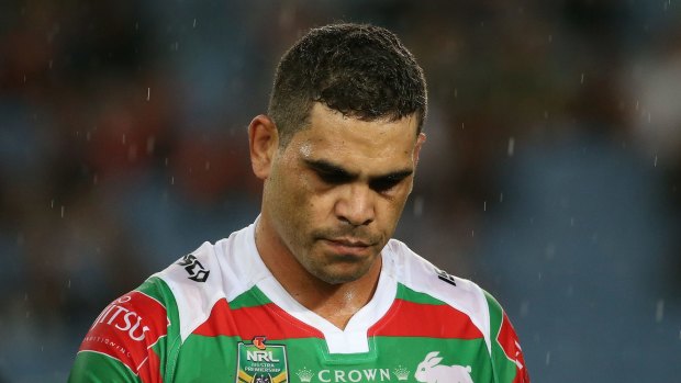 Tough night: Greg Inglis leaves the field after injury his knee in round one.