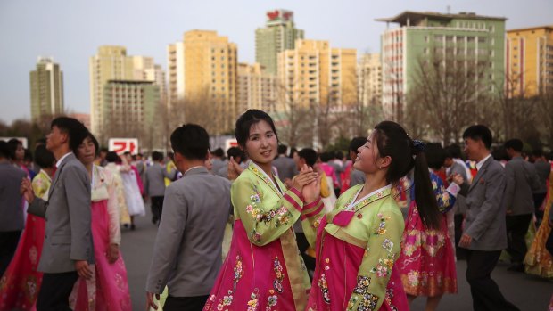 North Korean students participate in a mass dance event on Sunday to mark the late North Korean leader Kim Jong-Il's election as chairman of the National Defence Committee in 1993.