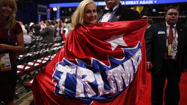 My hero: a delegate wears a Trump cape on the convention floor.