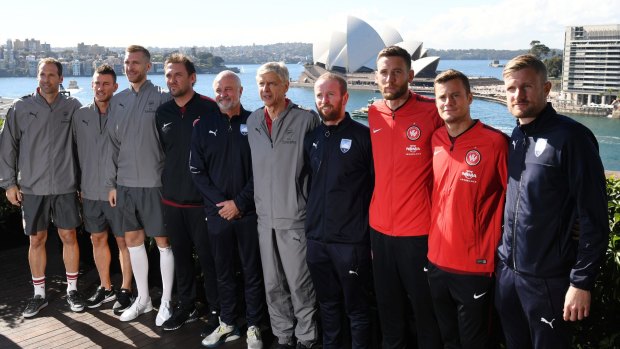 Engagement: Arsene Wenger poses with Petr Cech, Laurent Koscielny, Per Mertesacker, Graham Arnold and Sydney FC and Wanderers players.