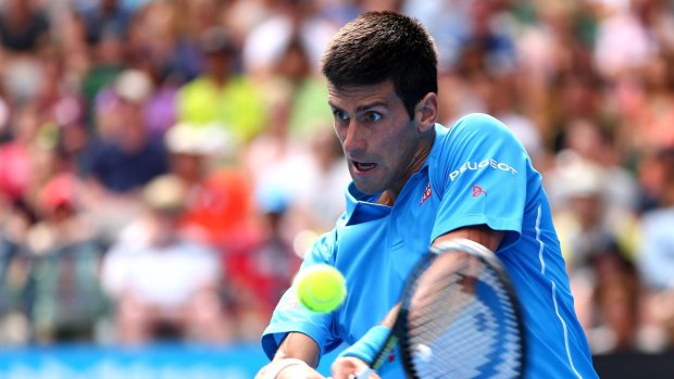 Novak Djokovic plays a backhand during his win on day two.