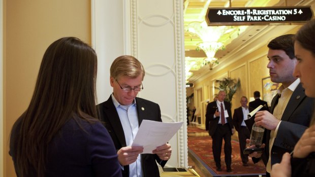 Bob McDonnell (with papers) at a conference in Las Vegas in 2012.  