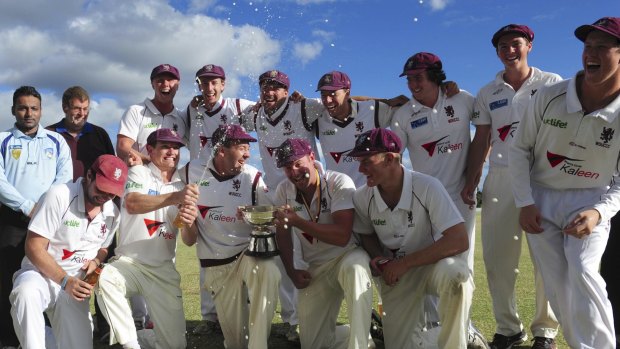 Winners of the Douglas Cup grand final at Chisholm Oval, Wests/UC, celebrate their win against Weston Creek/Molonglo. 