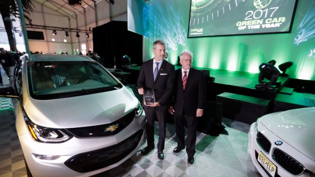 The 2017 Chevrolet Bolt EV is announced  winner of the Green Car of the Year Award in November. Major US car makers say Donald Trump's decision to pull out of the Paris Accord would not affect their pledges on climate change.