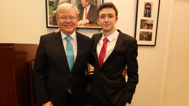Labor MP Kevin Rudd poses for photos with his son Marcus after annoucning his resignation at Parliament House in October 2013.
