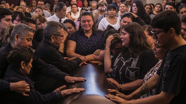 Friends and relatives say their last goodbyes during the funeral mass of slain veteran reporter Javier Valdez, in Culiacan Mexico, on Tuesday.