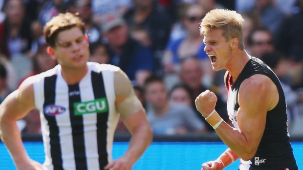Nick Riewoldt of the Saints (right) celebrates a goal before he went down.