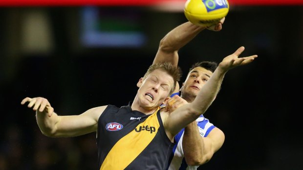 The Tigers' Jack Riewoldt, seen here in a clash with Kangaroos' Robbie Tarrant, was among the players who left SMALF for Precision Sports and Entertainment Group.