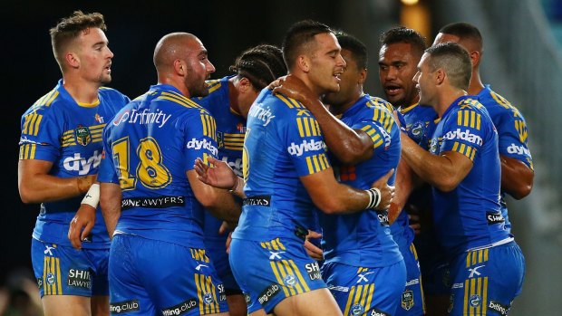 Dog catchers: Eels players celebrate a try by Brad Takairangi during the win over the Canterbury Bulldogs at ANZ Stadium.