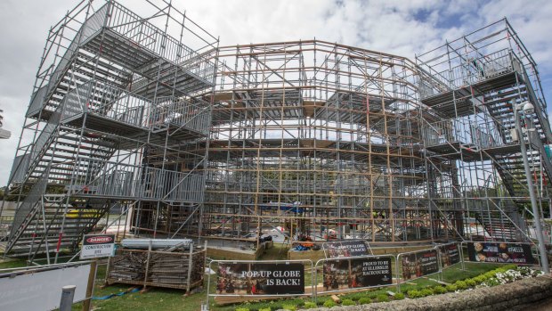 Workers build the modern version of Shakespeare's Globe Theatre, a three-storey, 200-tonne building that houses 900 people.